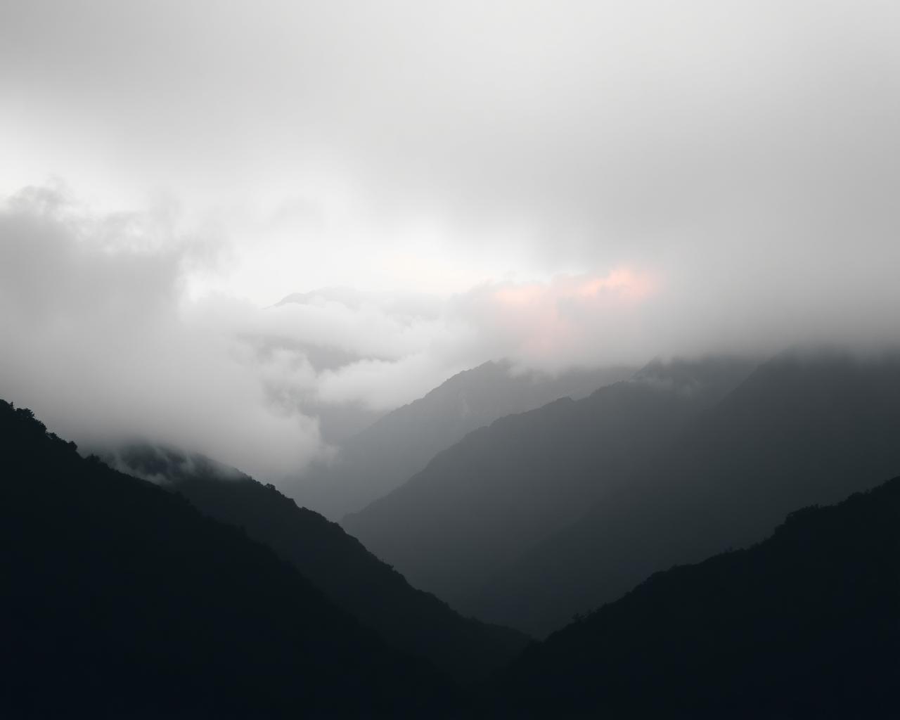 Mist rolling between Andean mountain peaks