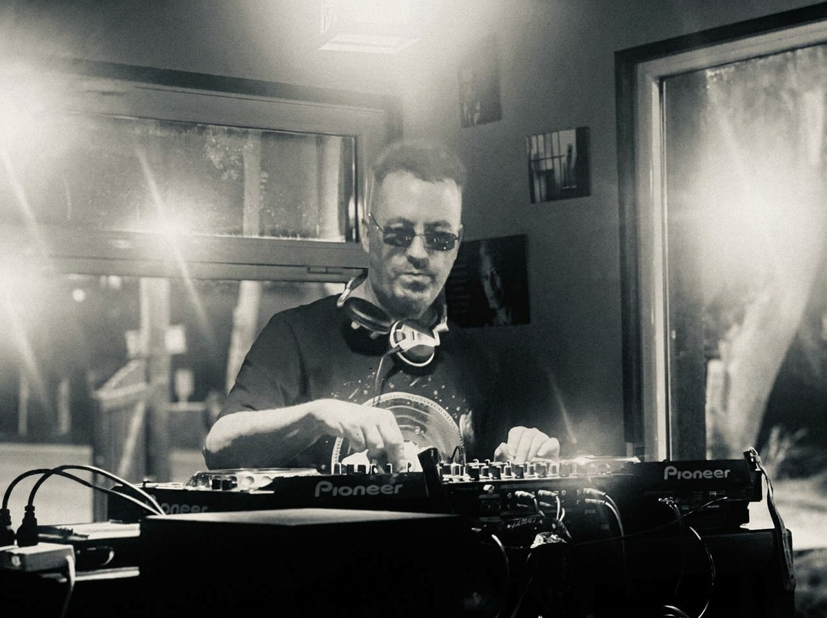 Yoel mixing on Pioneer CDJs in black and white